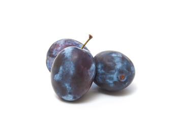 Fresh ripe plums from the garden isolated on white background