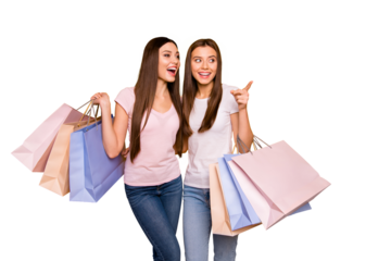 Portrait of nice cute charming feminine attractive cheerful straight-haired girls embracing holding in hands carrying new cool purchase isolated on bright vivid shine yellow background