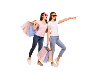 Full length body size view portrait of nice cute charming winsome attractive cheerful straight-haired girls carrying purchase showing far away isolated on bright vivid shine yellow background