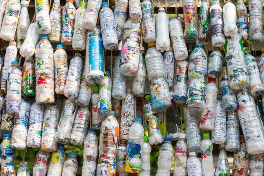 Plastic bottle bricks or eco-brick background. Pollution, environmental protection. Eco trend to reduce disposable plastics.