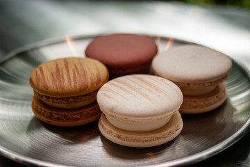 Macarons on a stainless steel plate, sensitive focus of macarons