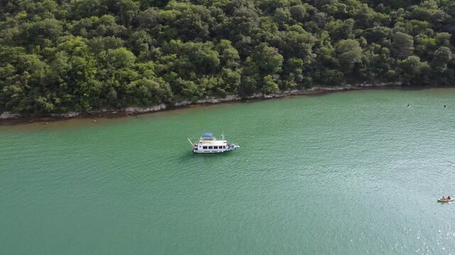 Drone footage of a fishers boat looking for fish in the Lim Fjord
