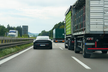 Cars on the motorway travel along a high-speed road.