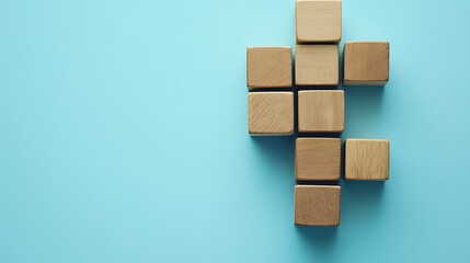 Wooden Blocks Arranged in a Pattern on a Blue Background