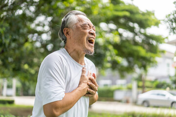 Senior asian adult elderly man with chest pain suffering from heart attack, health and medical, heart health, heart attack, world heart day, cardiovascular disease.insurance and hospital concept.