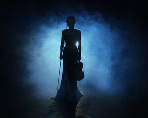 Dark shadow silhouette person woman violinist Sexy musician goes on stage plays music on the violin holding in hands musical instrument. Girl in black dress dark studio full smoke blue light back lit © kharchenkoirina