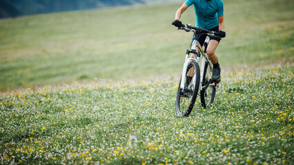Riding mountain bike in the beautiful mountain top