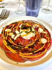 carpaccio and burrata with its seasoning