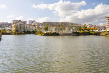 Modern architecture contrasting with old buildings in a city park