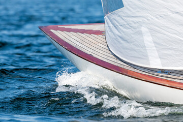 The bow of a sports yacht in the sea.