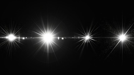 Bright white lights create a sparkling display on a dark background at night