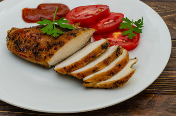 Close up shot of grilled chicken breasts on a plate