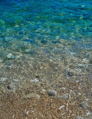Beach. Crystal clear sea water and sand.