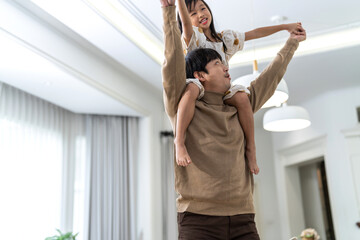 Portrait of enjoy happy love asian family mature father and little girl daughter smiling play laughing and having fun together.happy family and father's Day in moments good time at home