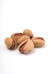 Pistachios nuts over white background. Healthy food concept.