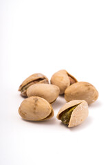 Pistachios nuts over white background. Healthy food concept.