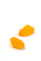 golden raisins isolated on white background. close up.
