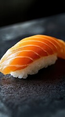 A piece of sushi with a white rice topping
