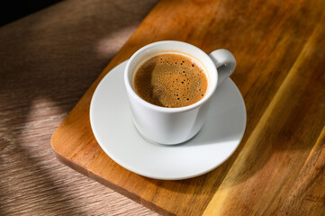 Traditional Turkish coffee cup placed on a wooden table