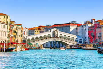 Landscape with  Rialto Bridge and gondola on the Grand Canal in Venice, Italy, Europe.