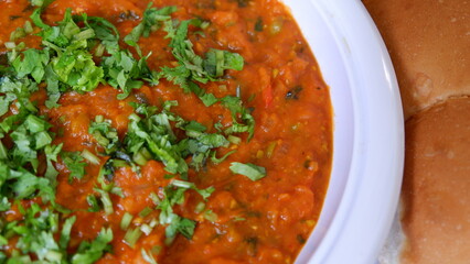 White plate of Indian Food Pav Bhaji