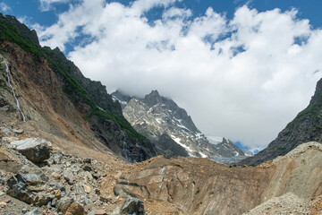 Melt waters of the Becho Glacier. Water flowing from the glacier on Ushba mountain. 
Dolra River in Becho Valley with panoramic views of Ushba Mountain. River photos taken with long exposure.