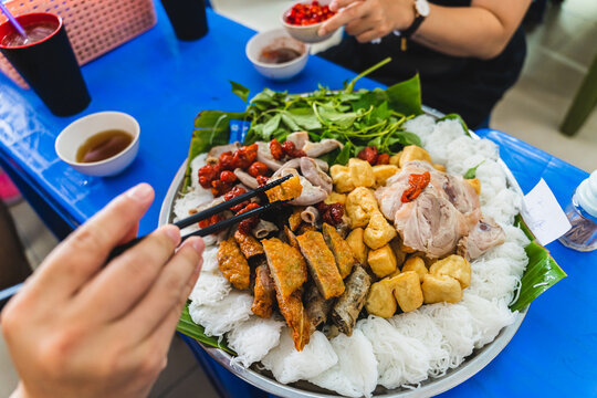 A delicious Vietnamese dish, Bun Dau Mam Tom, is a popular street food made from rice noodles with boiled meat, fried tofu, shrimp paste and green vegetables, cucumber and spices such as chili, lime
