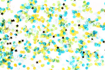 Festive background with confetti. Carnival greeting card with golden stars on white