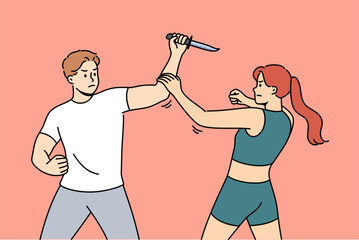 Strong woman fights off attacker with knife, demonstrating self-defense skills and knowledge of martial arts. Angry man, robber or rapist, attacks girl who knows rules of self-defense