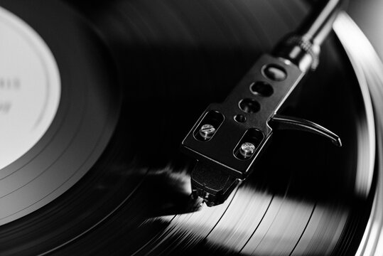 Segments of vinyl record spinning, macro view. Playing music, macro LP, loop