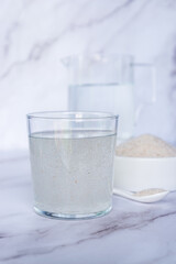A glass of water soluble psyllium husk dietary fiber supplement