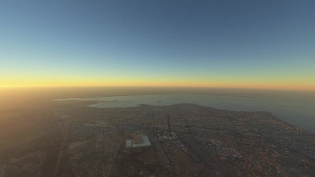 Circular aerial drone shot at sunset of Kuwait International Airport in Ghazali. Kuwait