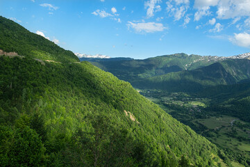 Georgia trekking routes. Magnificent Georgian mountains. Snowy and green mountains of Georgia. Svaneti mountains. Mountain landscapes in bloom in spring.