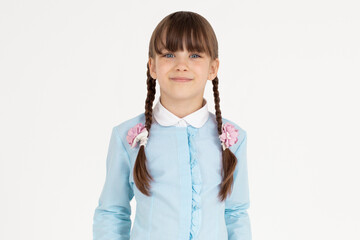 Indoor picture of young good-looking teenage girl isolated on white background in school uniform,...