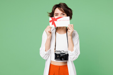 Traveler woman wear casual clothes hold cover eye with gift coupon voucher card for store isolated...