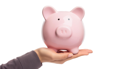 A hand holds a pink piggy bank, symbolizing savings and financial planning. Perfect for concepts related to money management.