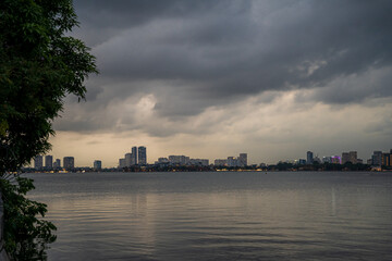 Fototapeta premium West Lake in Hanoi in the dark cloudy evening. Ha Noi cityscape. Travel concept