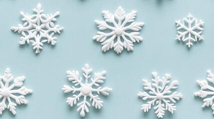 White snowflakes on a plain white or blue background, highlighting their unique symmetrical patterns. SEAMLESS PATTERN.