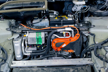 close-up in clean car service in the front of the car under the hood car power wiring system engine part full check up
