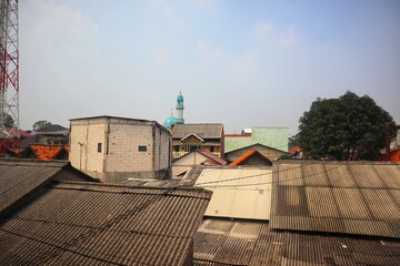 view of the roofs of houses densely packed in urban areas.