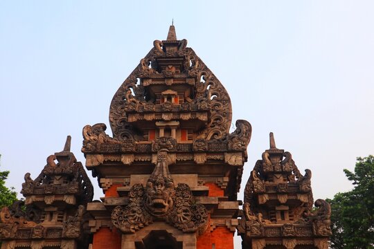 Top of the Kori Agung (Paduraksa roofed architectural style) against the sky.