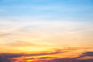 Fototapeta premium Beautiful , luxury soft gradient orange gold clouds and sunlight on the blue sky perfect for the background, take in everning,Twilight, Large size, high definition landscape photo