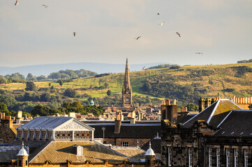 Edinburgh's historic skyline with church spire and distant hills panoramic view