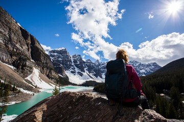 Fototapeta premium Young woman in Moraine lake, Banff National Park, Canada