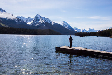 Summer landscape and people kayaking and fishing in Maligne lake, Jasper National Park, Canada