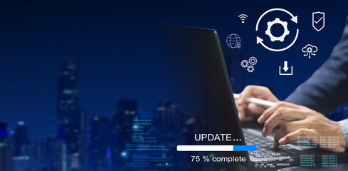 A business person updates software, installs an update process, and upgrades the software version...
