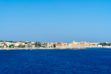 Fototapeta premium Fort of St. Nicholas, fortress near port of Mandraki in city Rhodes view from sea on island of Rhodes, Greece