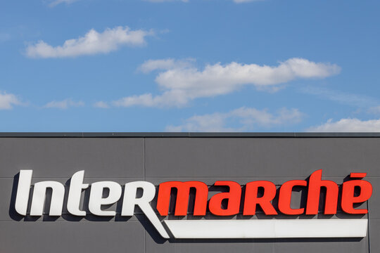 Poznan, Poland. 11 August, 2024: Intermarche Supermarket Exterior Signage with Blue Sky