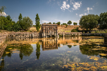 Obraz premium Eflatun Spring is a sacred water monument built during the Hittite Period. The monument depicts the gods who carry the sky and establish a connection between the earth and the sky.