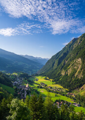 Fototapeta premium Aerial view of the beautiful village Heiligenblut, Austria. Grossglockner mountain landscape with high snowy peaks. Hohe Tauern